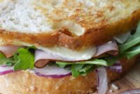 Golden Toasted Ham, Melted Cheddar, and Peppery Arugula Sandwich