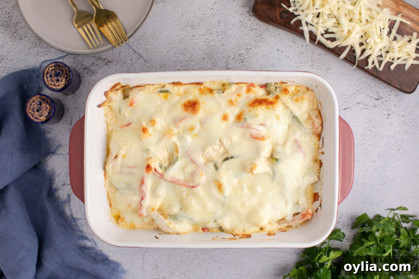 baked chicken philly cheesesteak casserole, bubbly and golden brown, fresh out of the oven