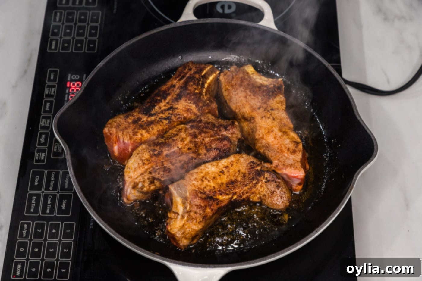 seared pork ribs in a skillet