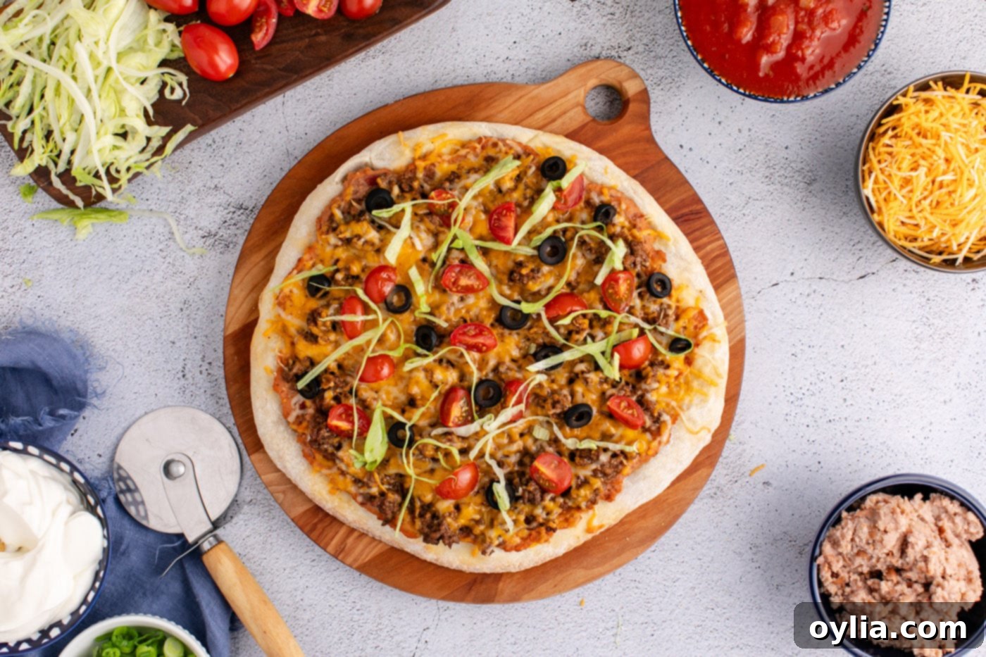 easy baked taco pizza on a serving board