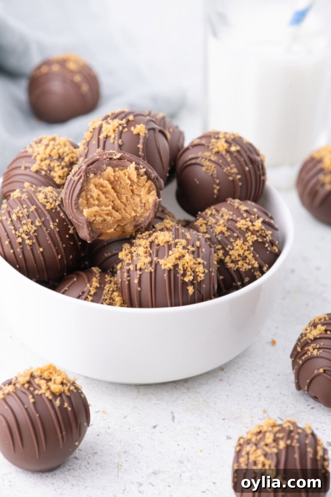 Bowl of Nutter Butter Balls with more resting on the table