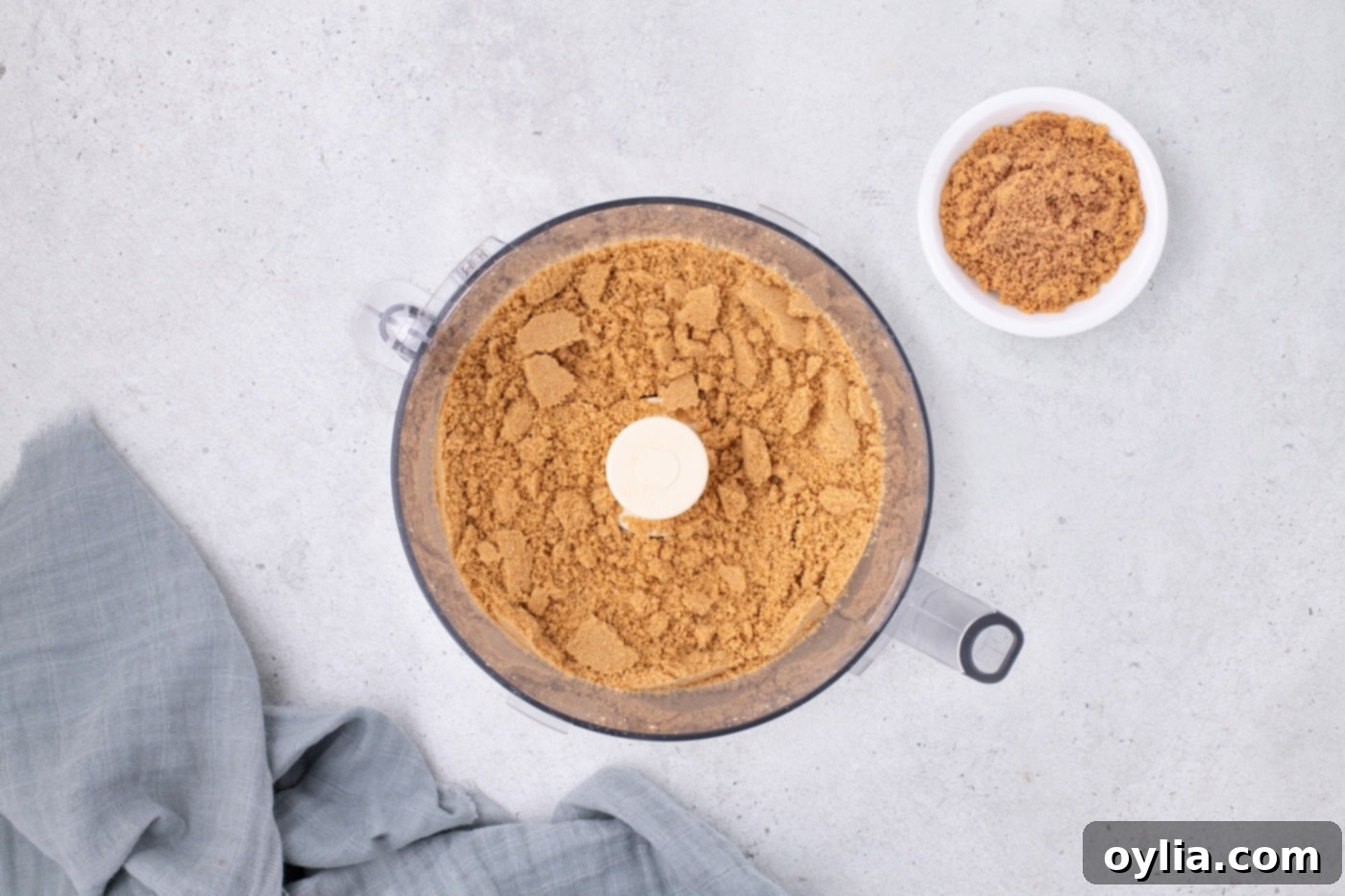 Nutter Butter cookie crumbles in a food processor, ready for the next step.