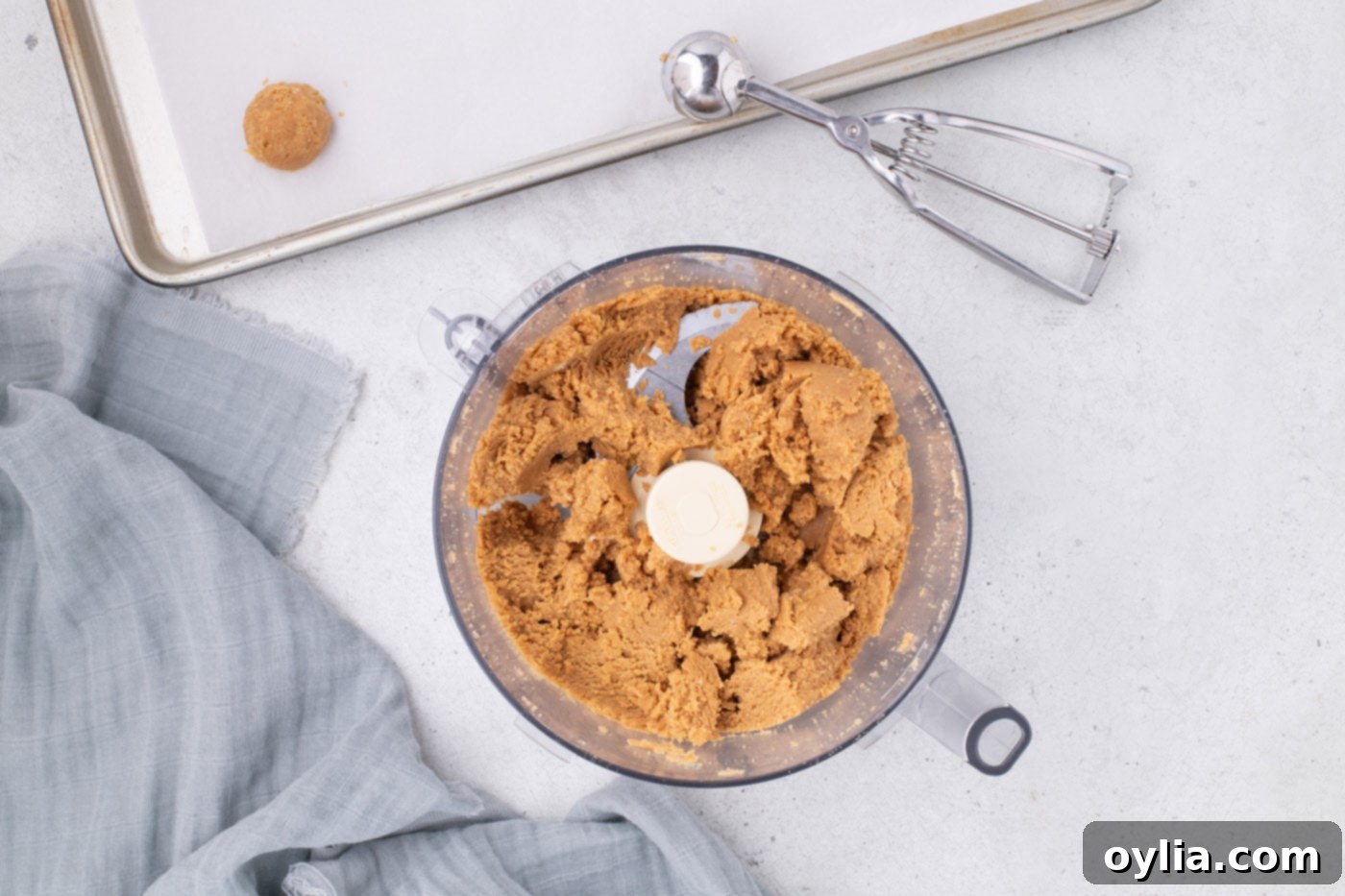 The Nutter Butter cookie ball dough in a food processor, perfectly mixed and clumped together.