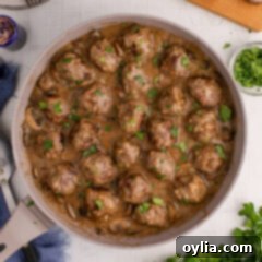Overhead photo of a skillet of Salisbury Steak Meatballs, ready for serving