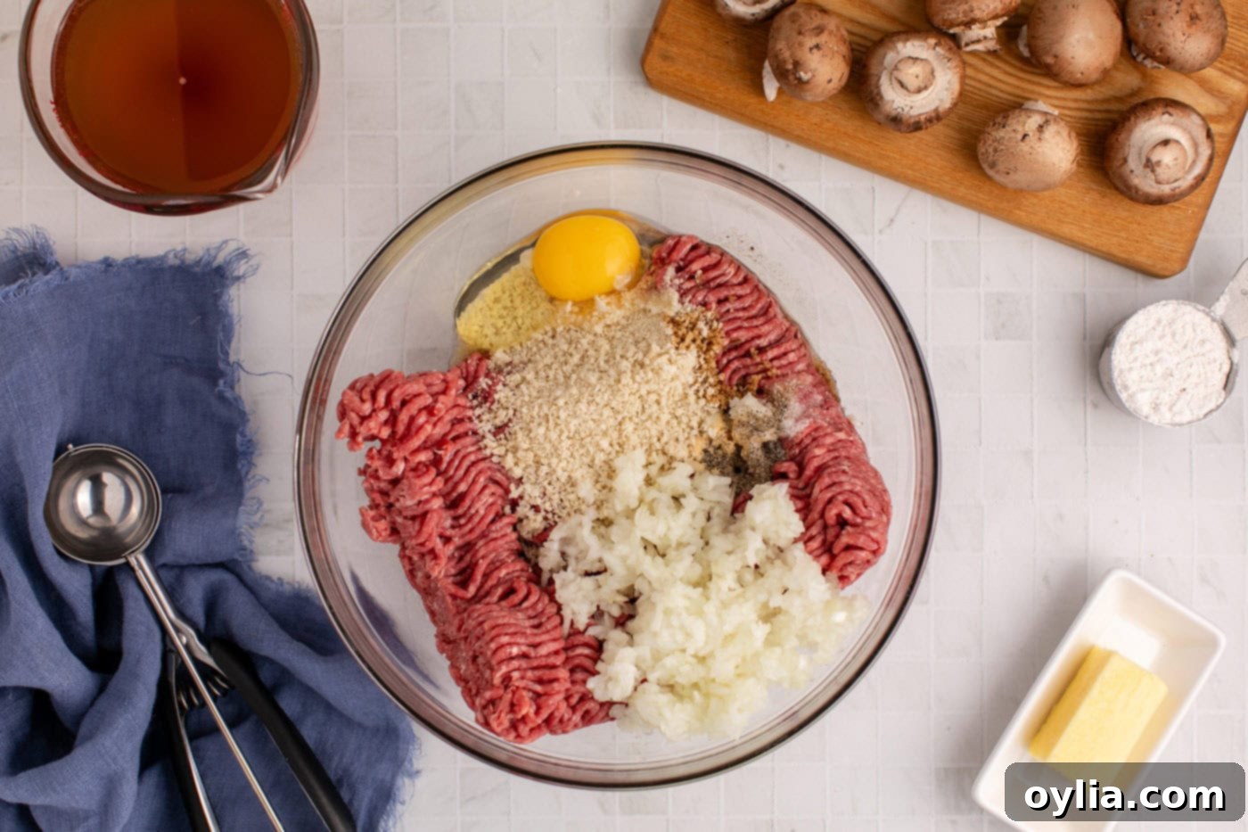 meatball ingredients in a mixing bowl with spices and binders