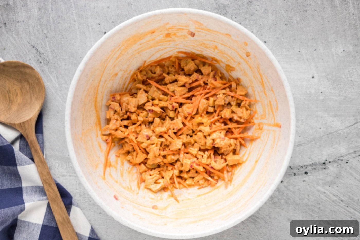 Easy buffalo chicken salad thoroughly mixed in a large bowl, ready to be served or chilled.