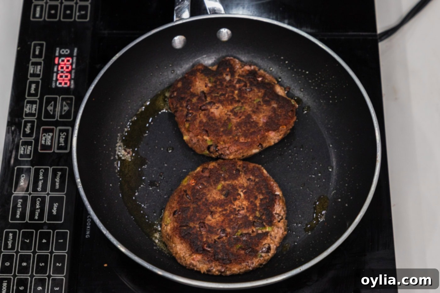 cooked black bean burgers in a skillet