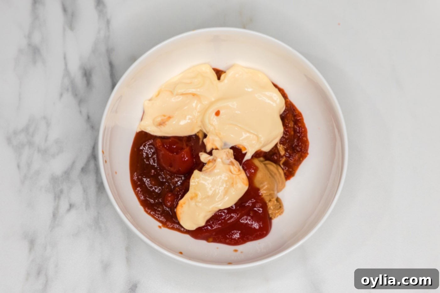 peanut butter, Asian sweet chili sauce, sriracha, ketchup, and mayonnaise in a bowl