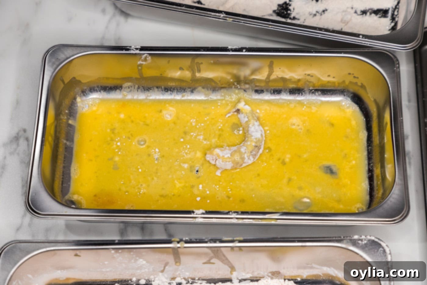floured shrimp added to egg