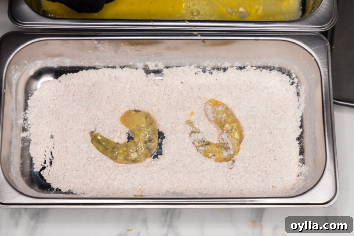 dredging shrimp in flour and egg