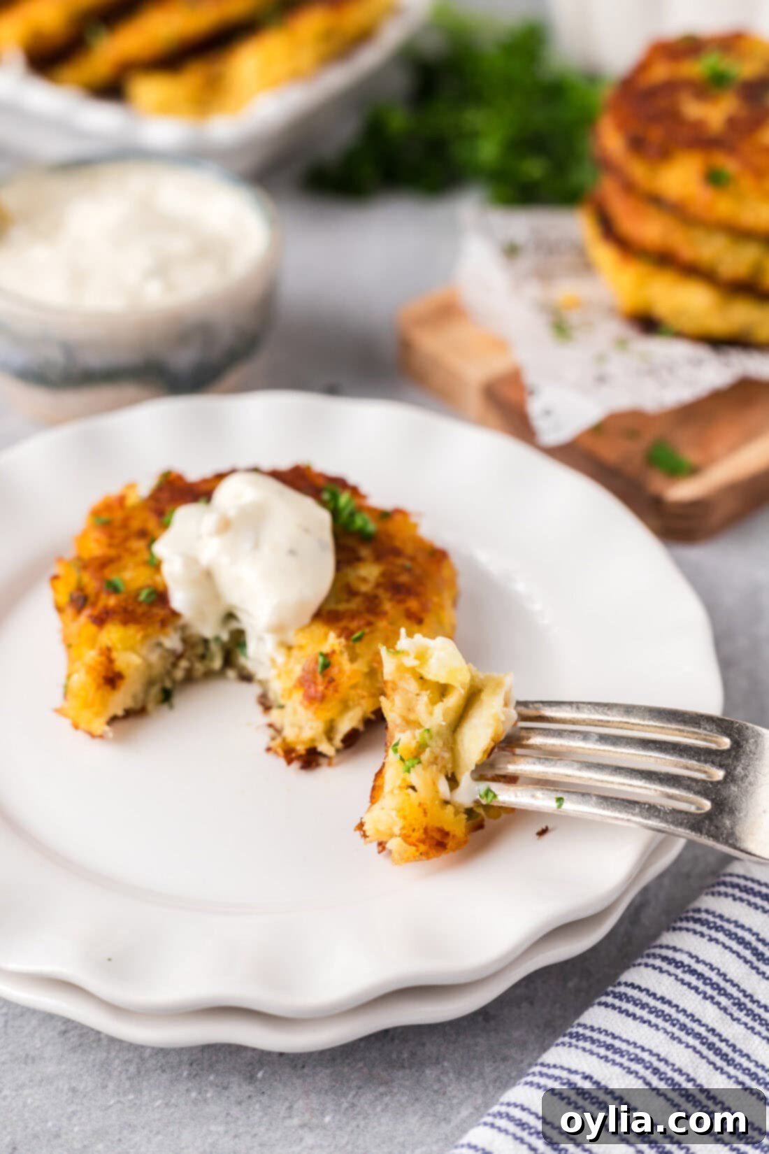 Cod Fish Cake on a plate with a piece on a fork, ready to eat