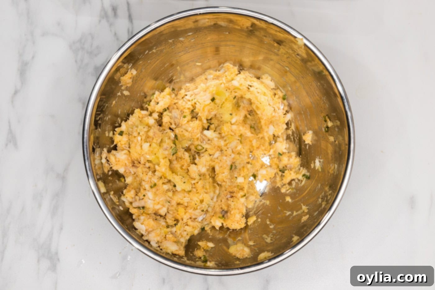 cod fish cakes mixture in a bowl, showing texture
