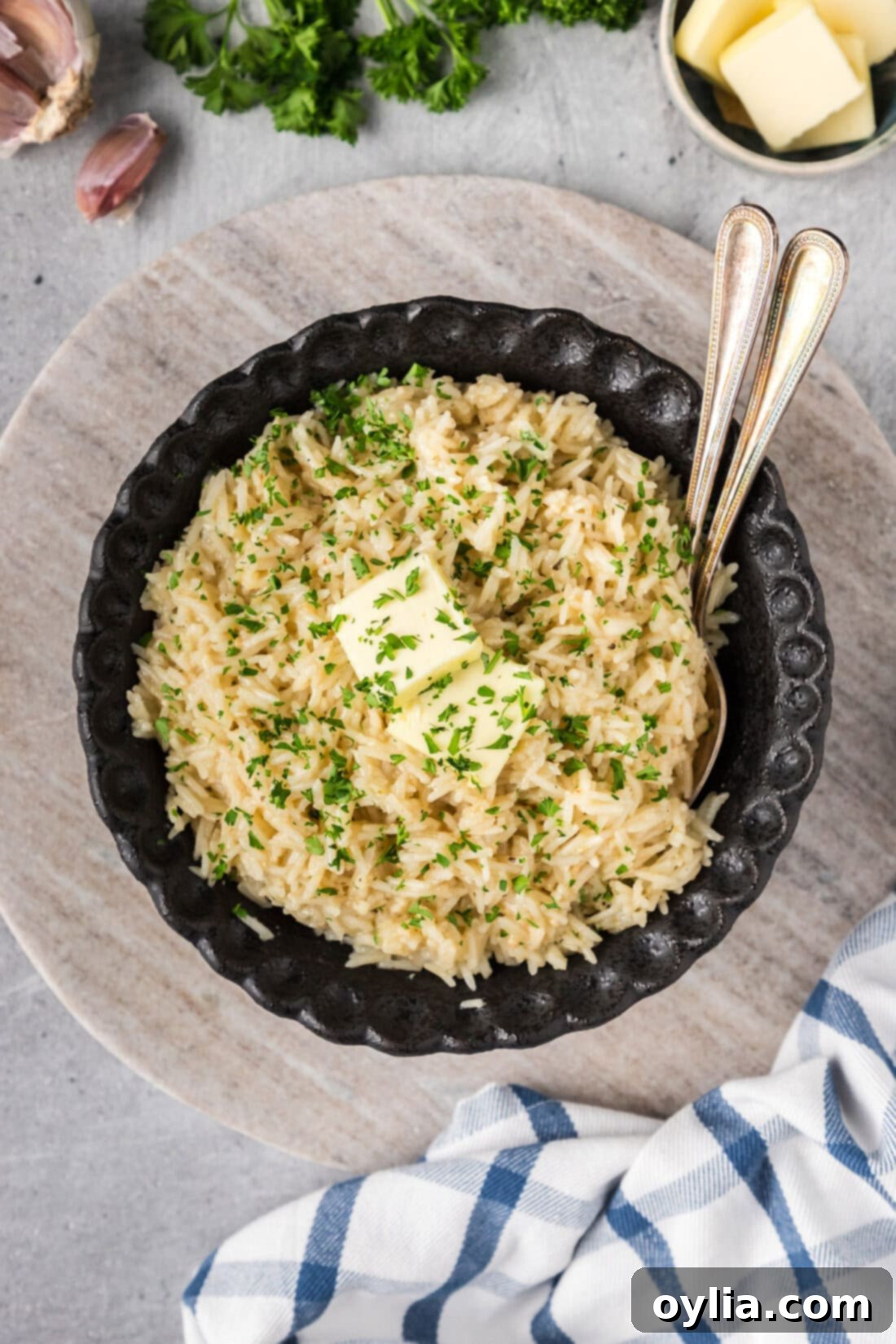 Bowl of Garlic Butter Rice with two spoons in it, ready to be served