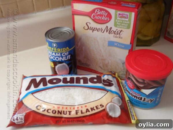 A bowl of white cake batter being mixed, showing the smooth, creamy texture.