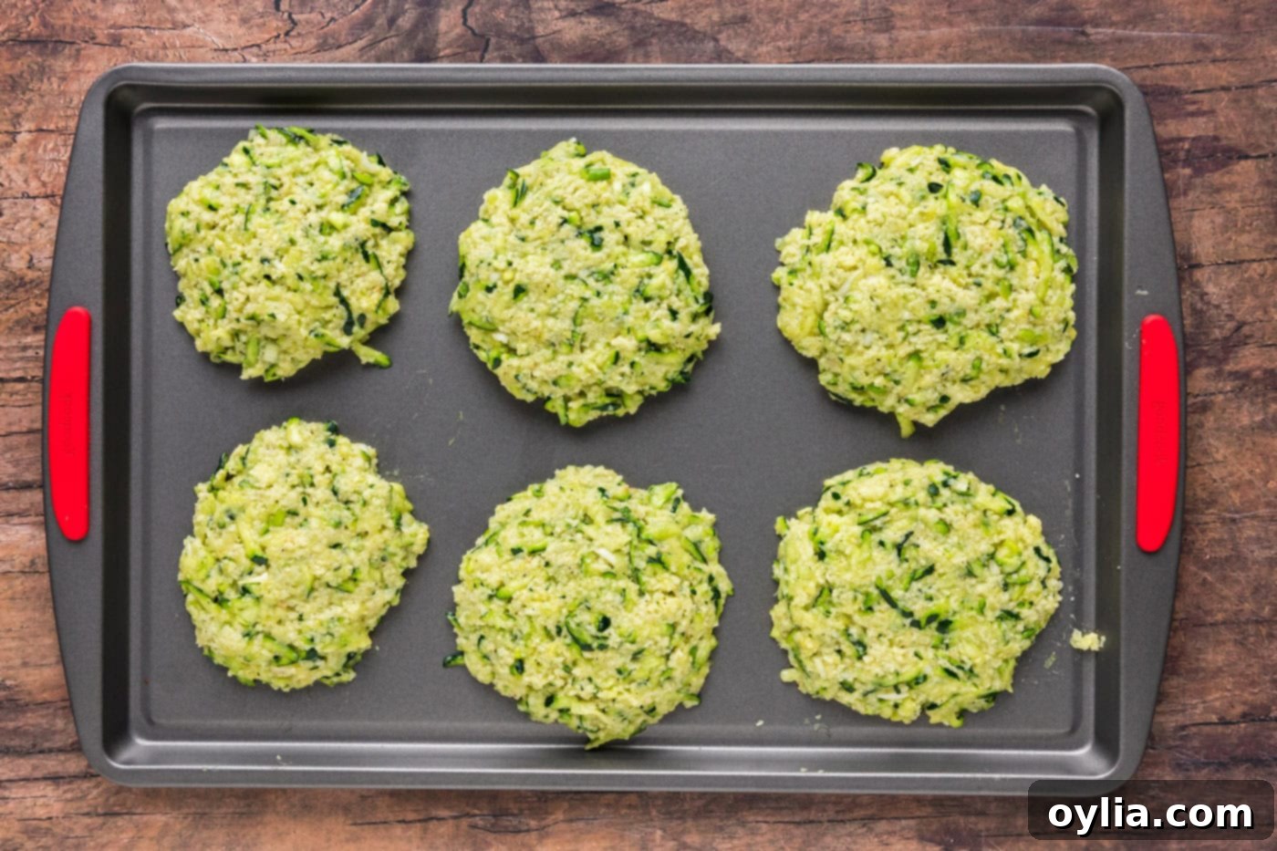 zucchini fritters on a baking sheet