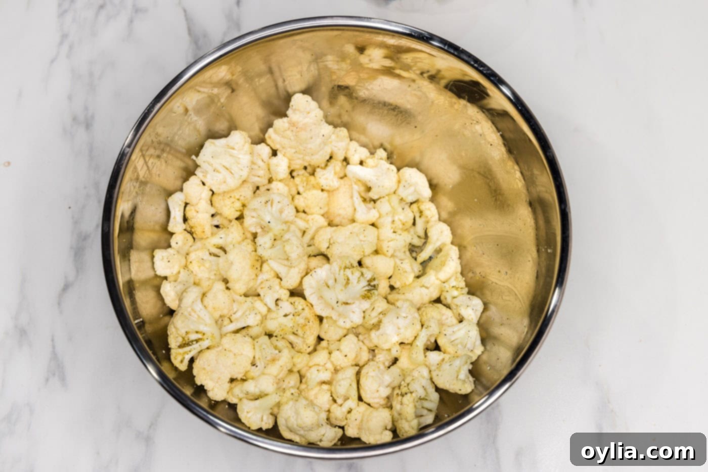 seasoned cauliflower florets in a bowl