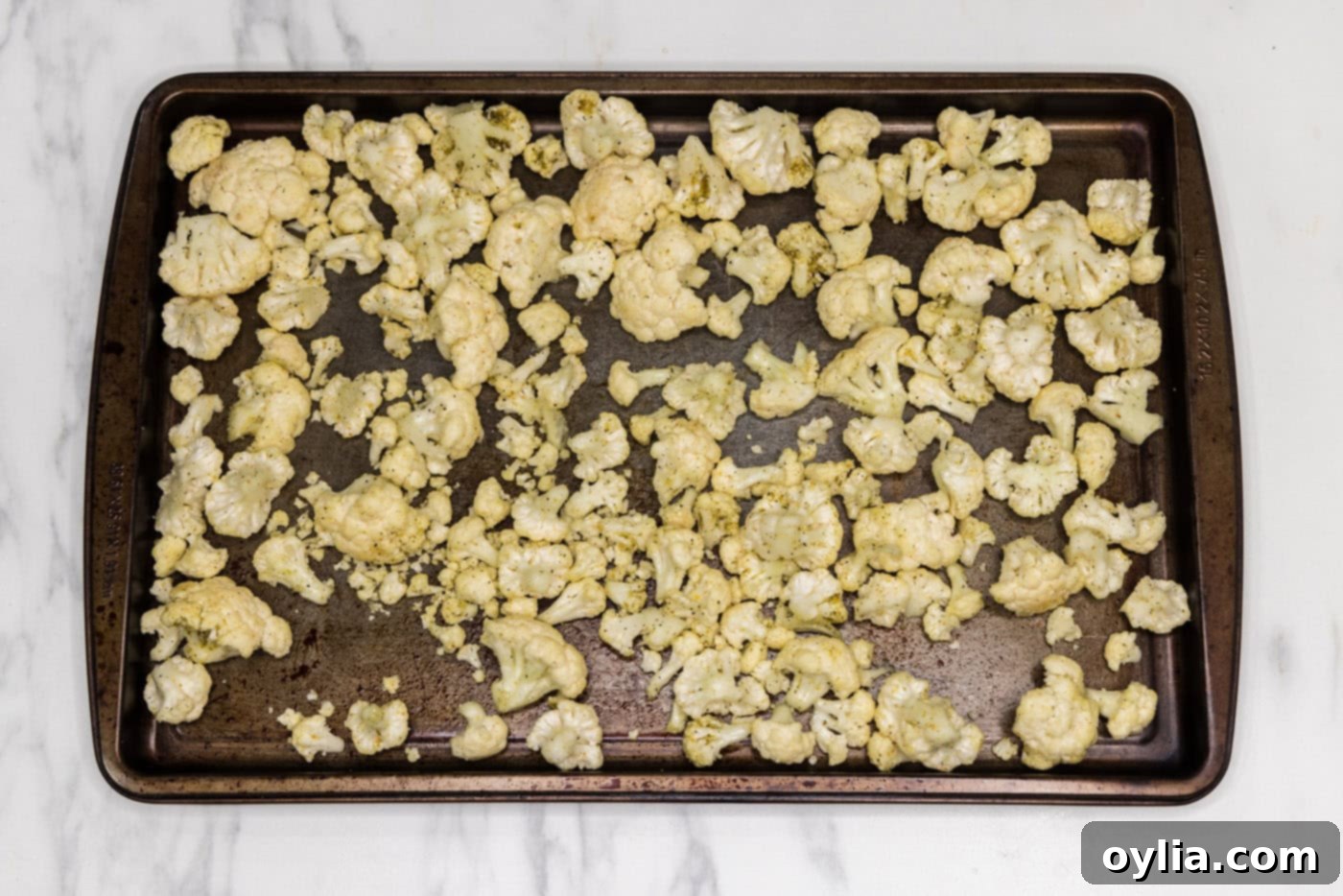 cauliflower florets on a baking sheet