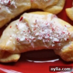 A close up of a white chocolate candy cane crescent.