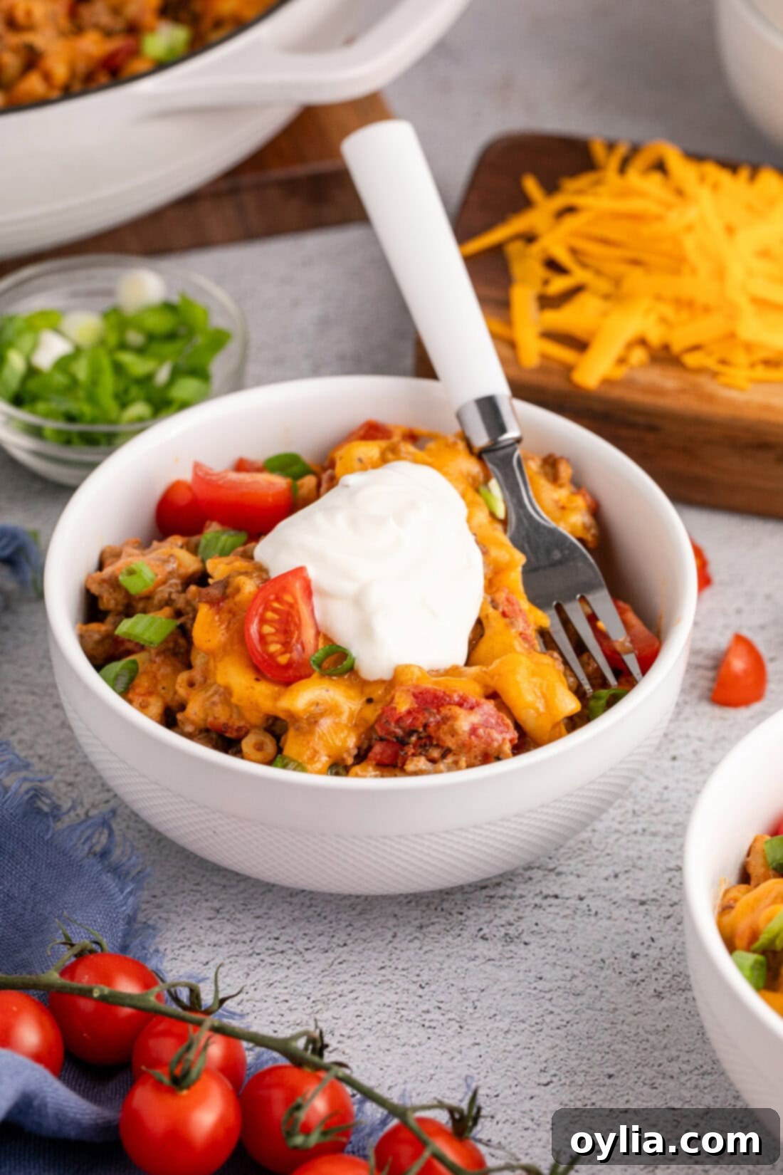 Bowl of Taco Macaroni and Cheese topped with sour cream