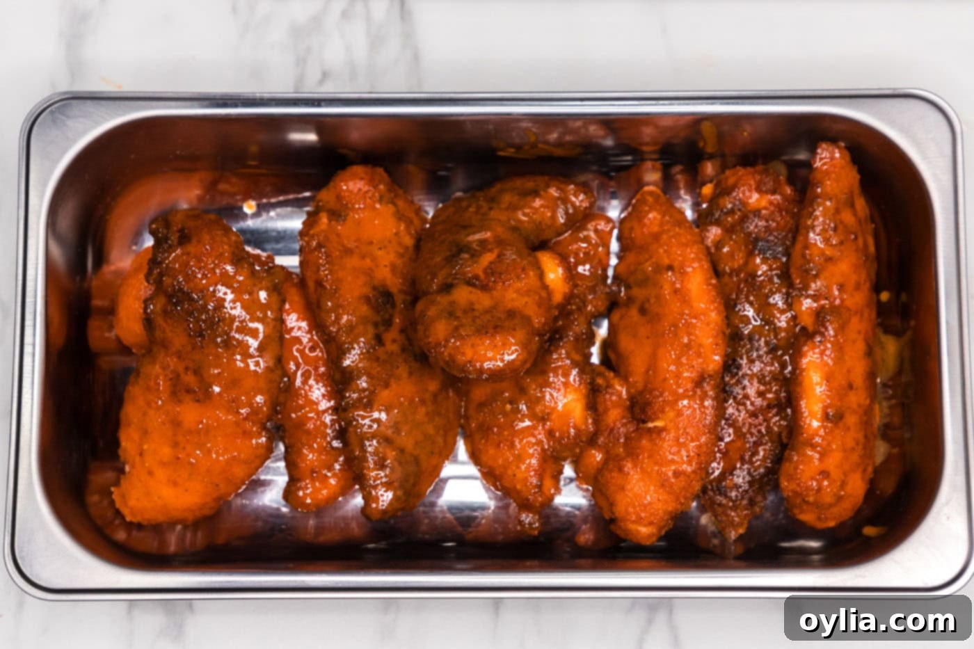 buffalo chicken tenders on a pan