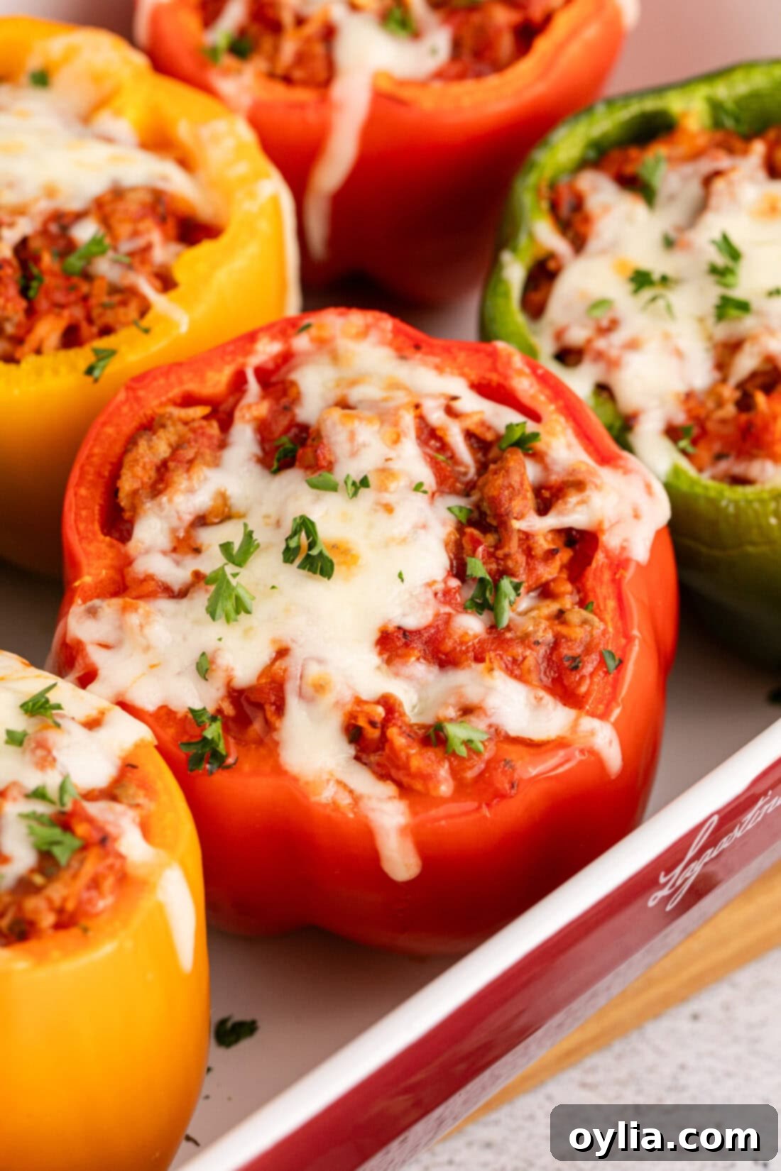 Hearty Turkey Pepper Boats 2 Close up photo of Turkey Stuffed Peppers in a dish, showing the rich filling and melted cheese on top.