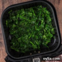 Air fryer full of Air Fryer Spinach