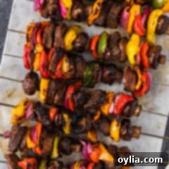 Ultimate Steak Kabobs 12 Close up photo of Steak Kabobs on a marble platter