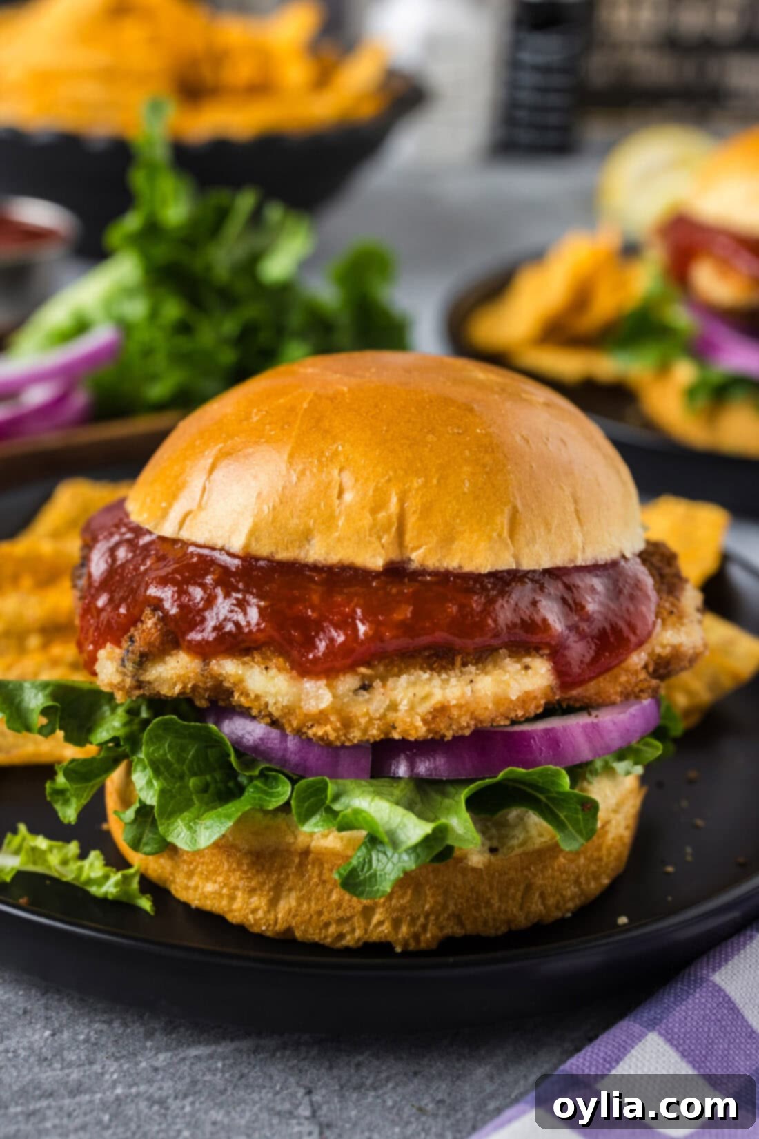 Gourmet Shrimp Burger 2 Shrimp Burger on a plate with another burger in the background