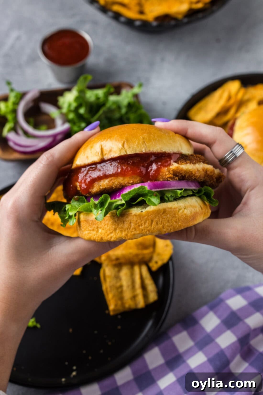 Gourmet Shrimp Burger 3 Hands holding up a Shrimp Burger
