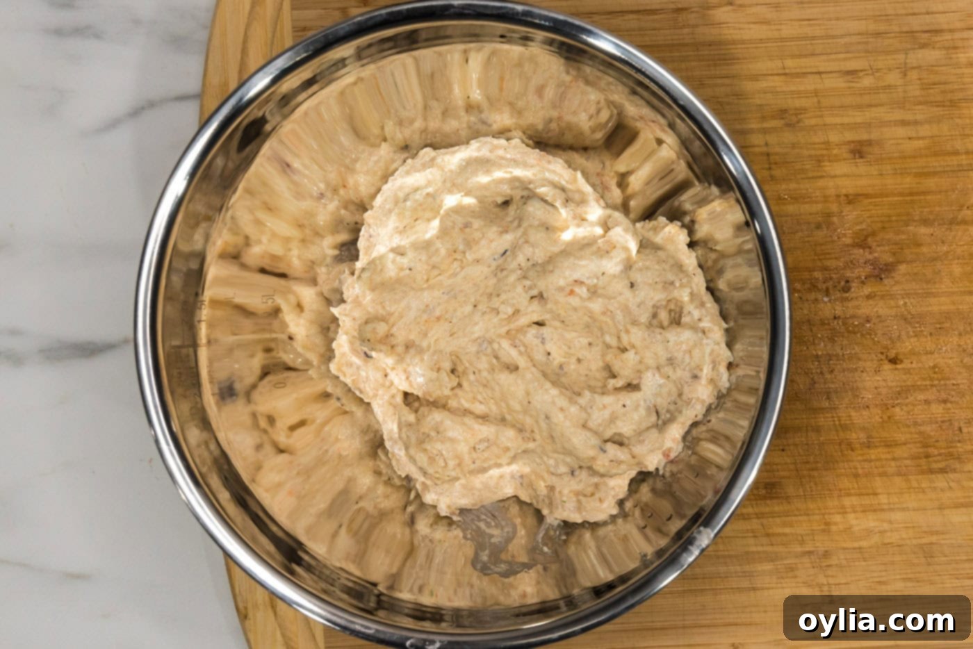 blended shrimp mixture added to bread crumbs in a bowl