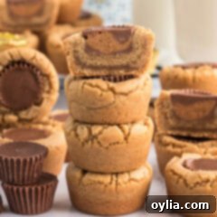 Half of a Reese’s Peanut Butter Cup Cookie stacked on top of three Reese’s Peanut Butter Cup Cookies
