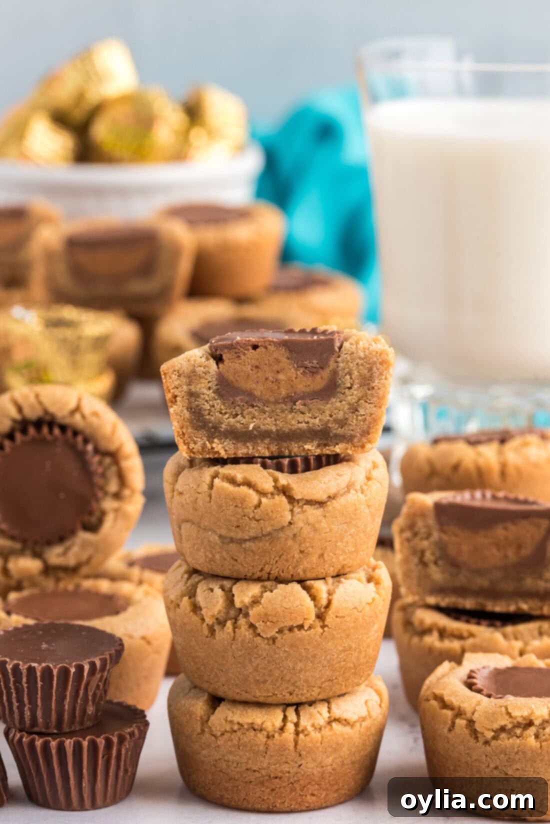 Stack of Reese’s Peanut Butter Cup Cookies with the top cookie cut in half