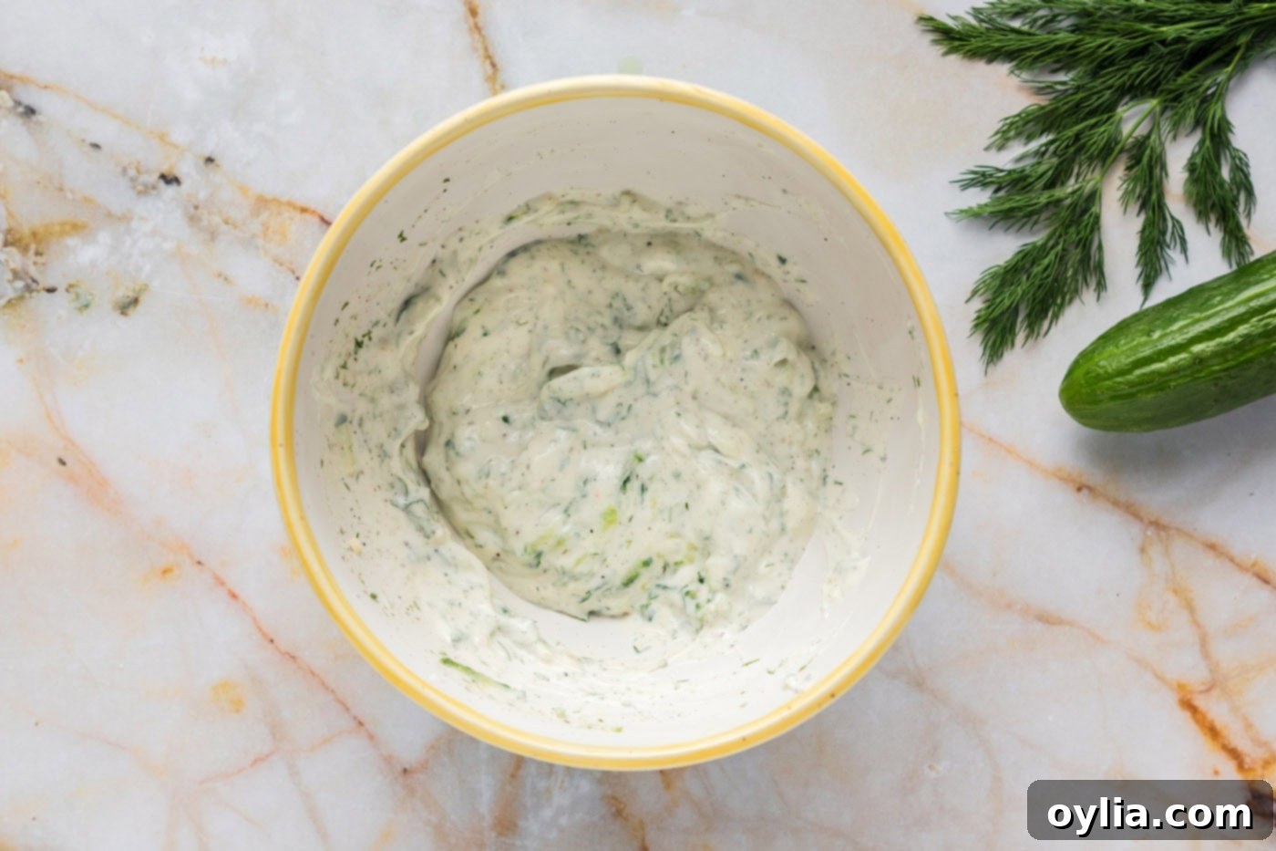tzatziki sauce combined in a mixing bowl