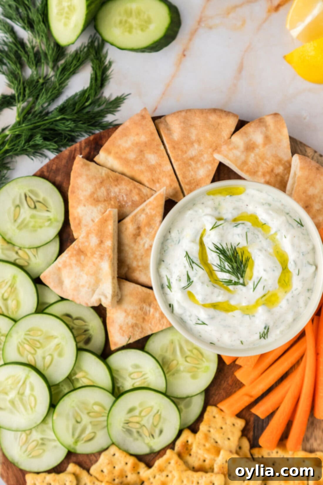 Refreshing Greek Tzatziki Dip 9 Close up photo of a bowl of Tzatziki Sauce topped with olive oil
