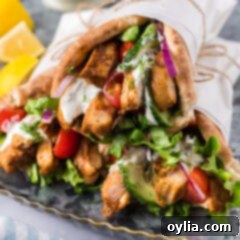 Homemade Chicken Shawarma 11 Close up photo of Chicken Shawarma pita wraps stacked on top of each other