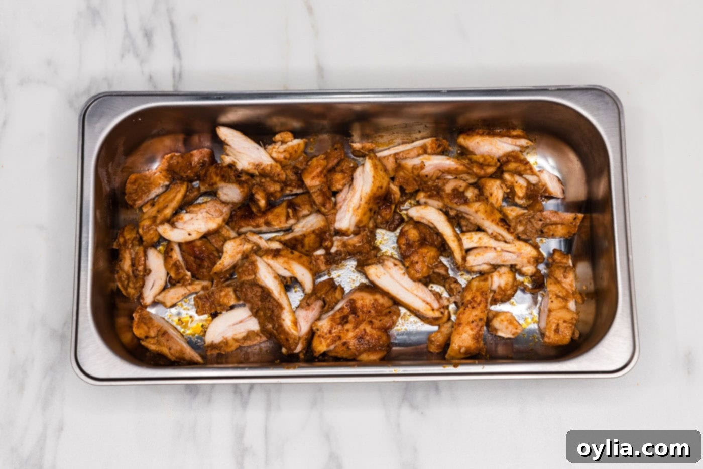 sliced chicken in a pan
