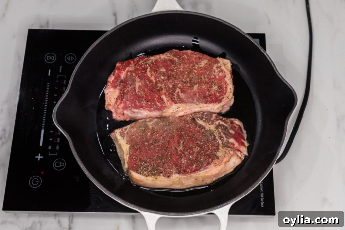 searing new york strip in a skillet