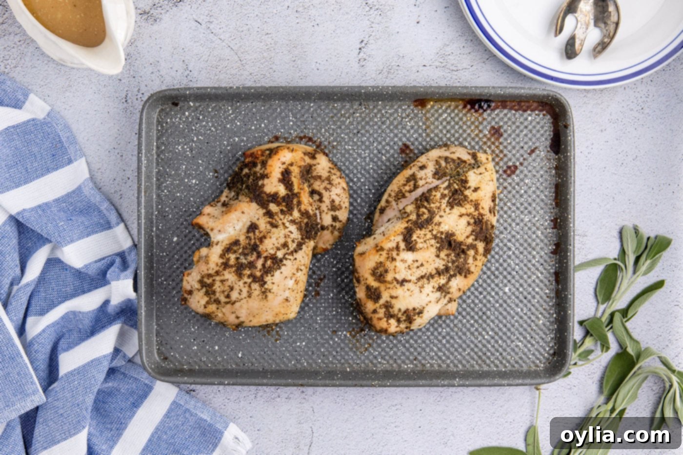 turkey breasts resting on a baking sheet