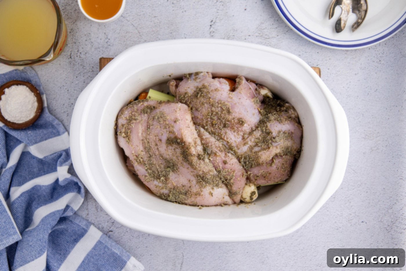 seasoned turkey breasts in a slow cooker crock