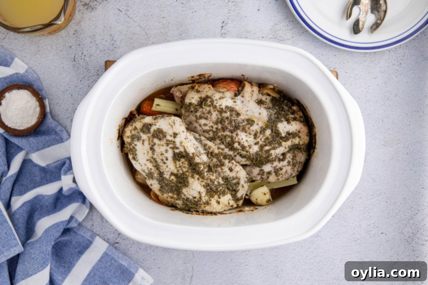 cooked turkey breast in a slow cooker crock
