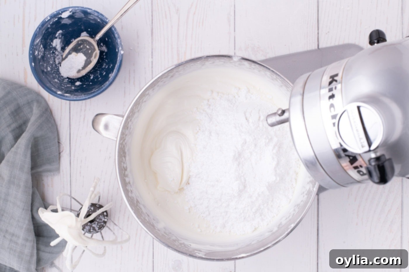 heavy cream, cream cheese, vanilla, and powdered sugar added to a stand mixer bowl