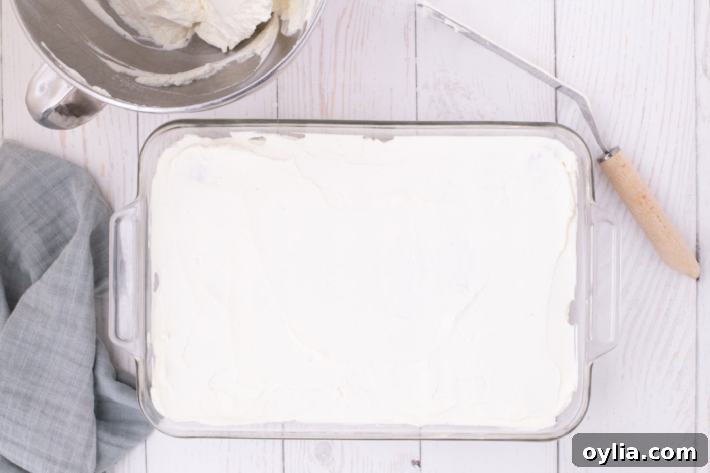 whipped cream layer over nutter butter cookies in a dish