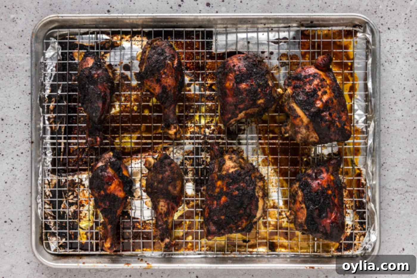 baked jerk chicken on a baking sheet