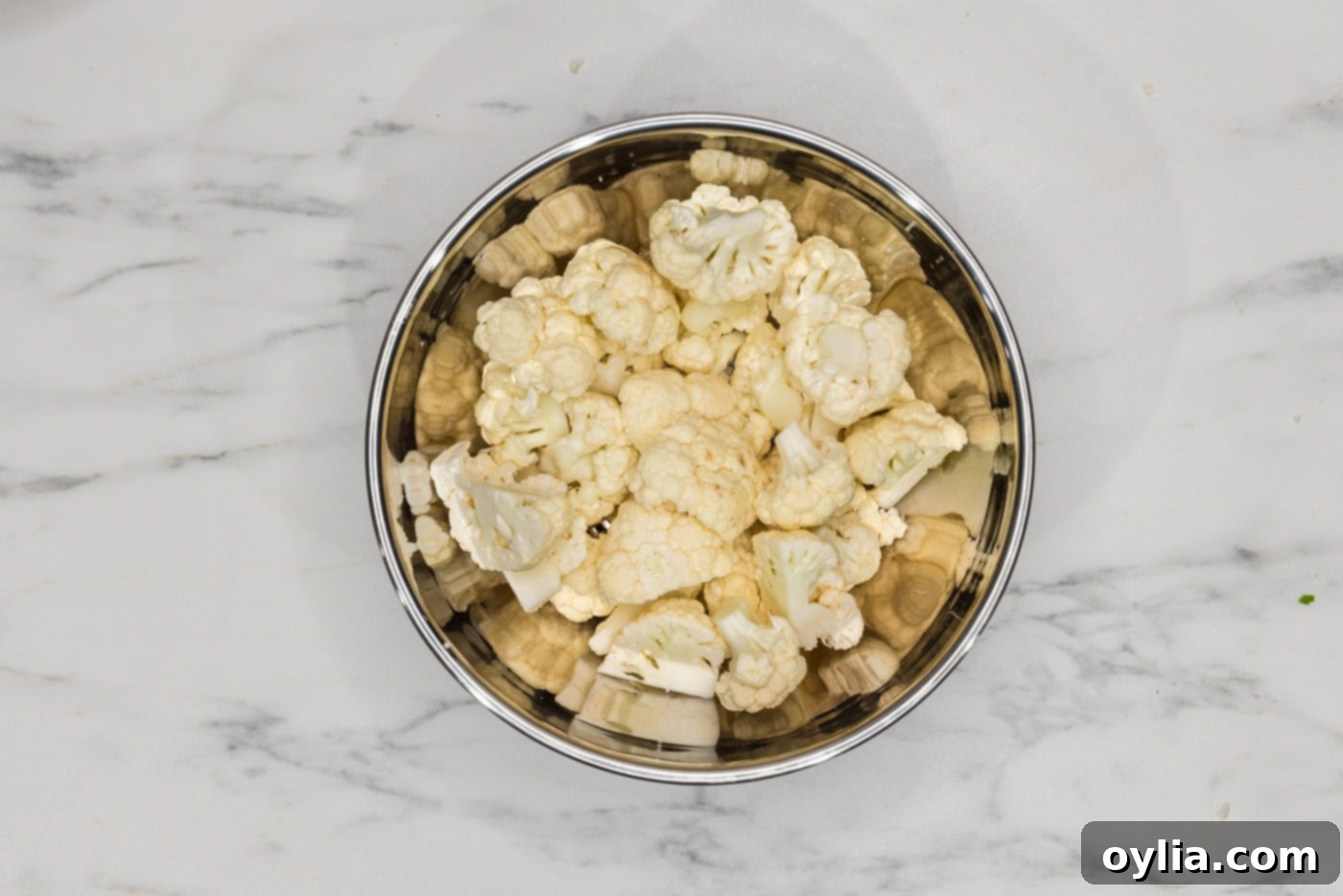 cauliflower cut into florets in a bowl