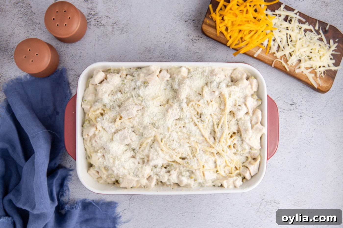 Turkey Tetrazzini 8 Creamy turkey and spaghetti mixture spread evenly in a 9x13 casserole dish before topping