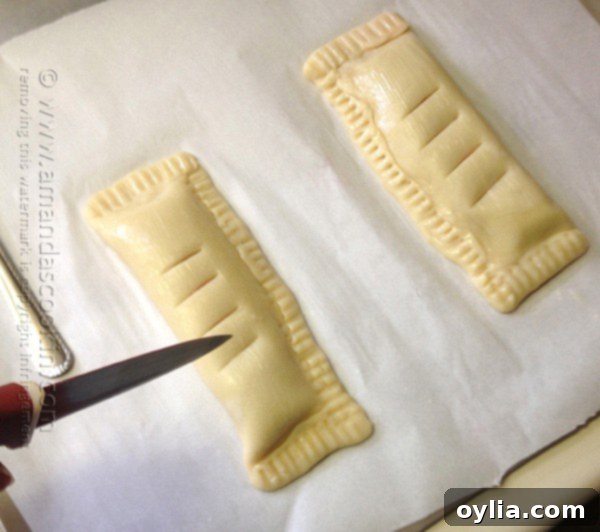 Cherry pie with steam vents cut into the top, ready for the oven
