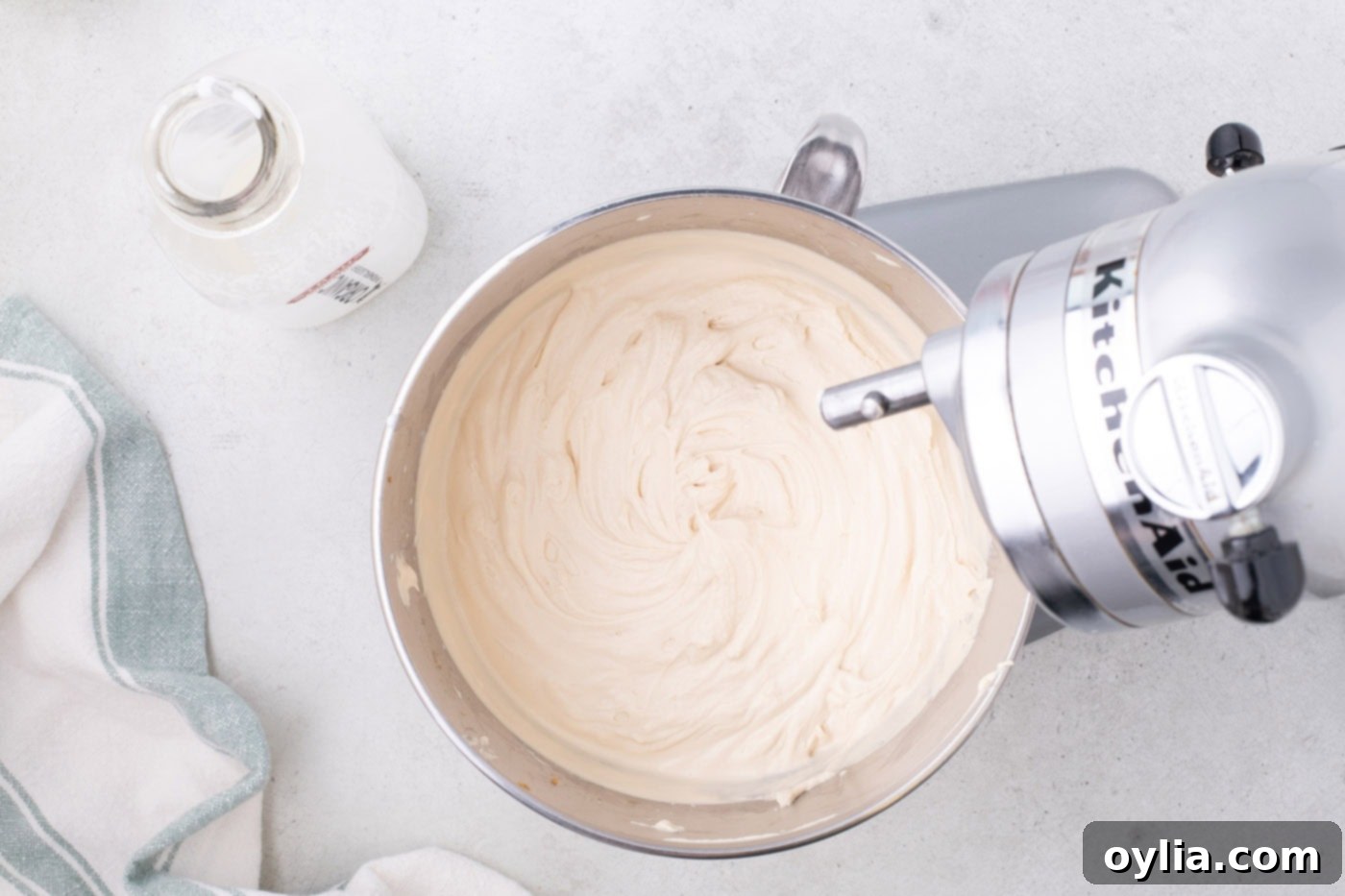 whipped cream cookie butter mixture in a stand mixer bowl