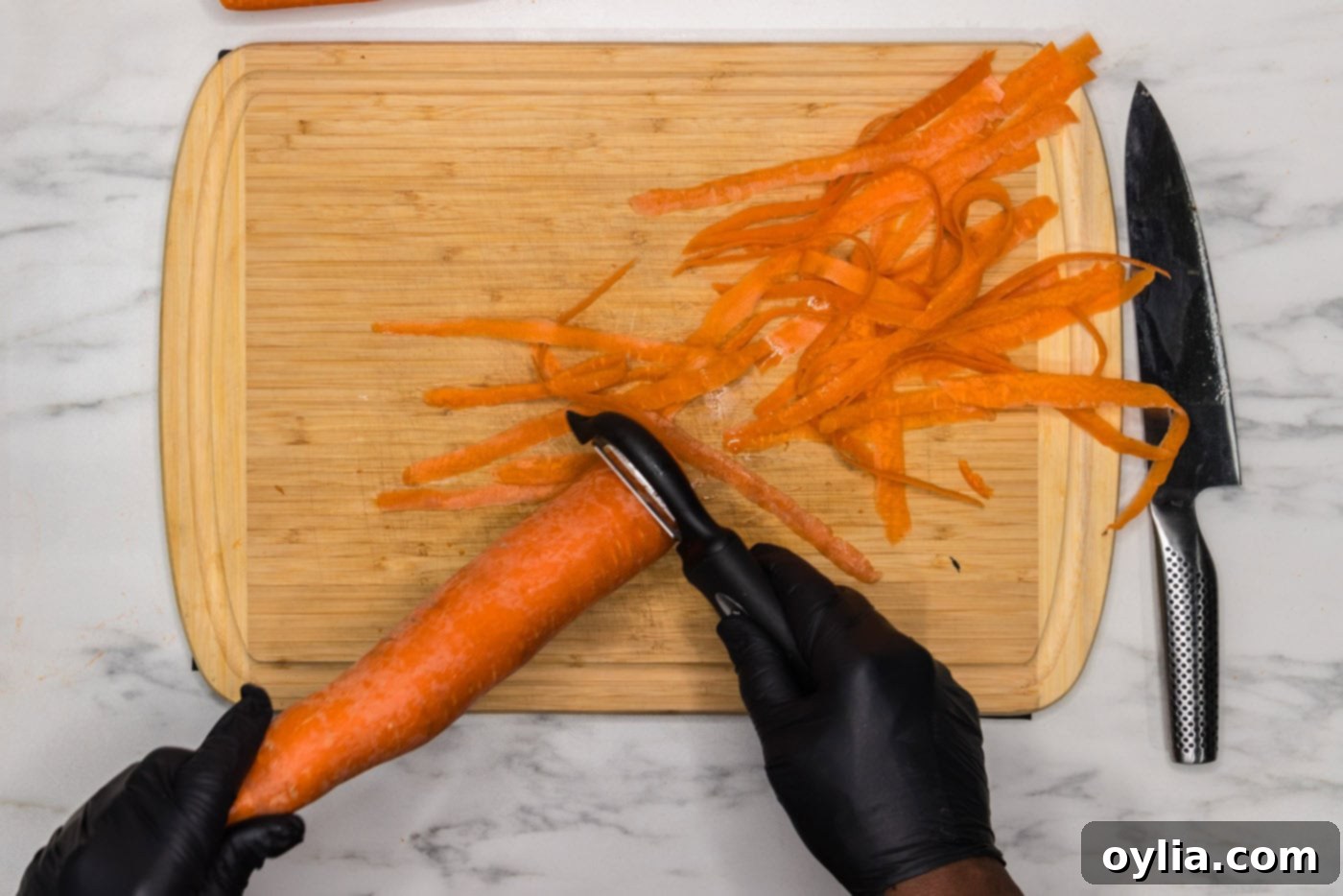 peeling carrot with a vegetable peeler