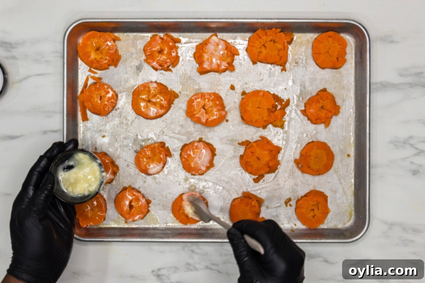 brushing smashed carrots with butter