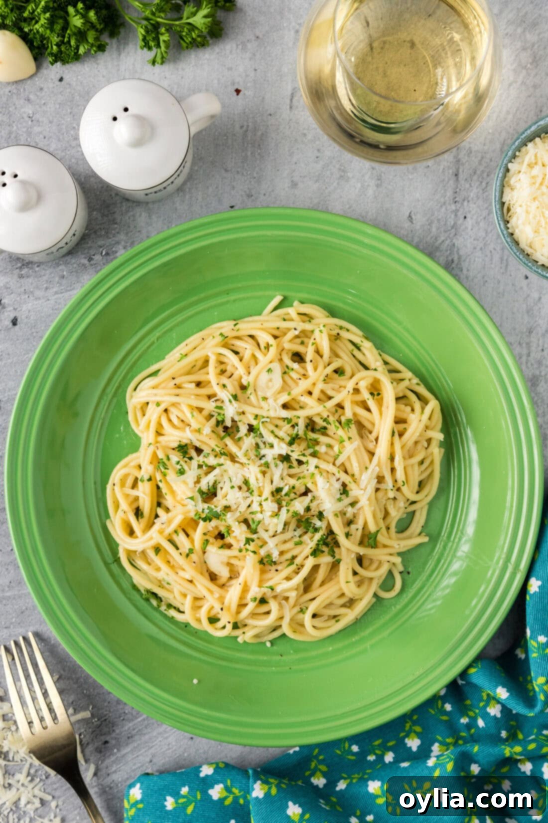 Buttery Garlic Noodle Bliss 2 Serving of Garlic Butter Pasta on a plate topped with parmesan and parsley, ready to eat